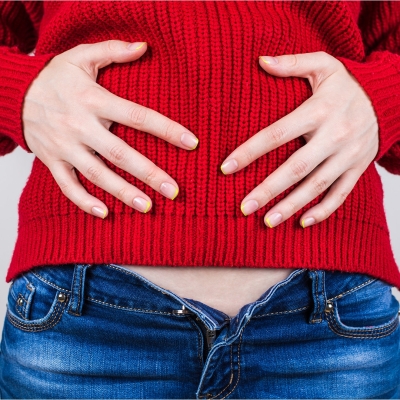 red sweater bloated woman